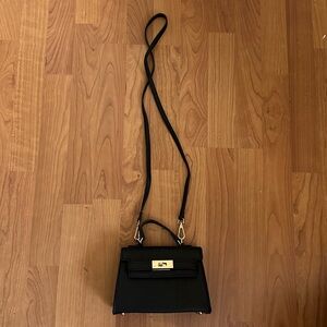 Black shoulder strap top handle mini purse